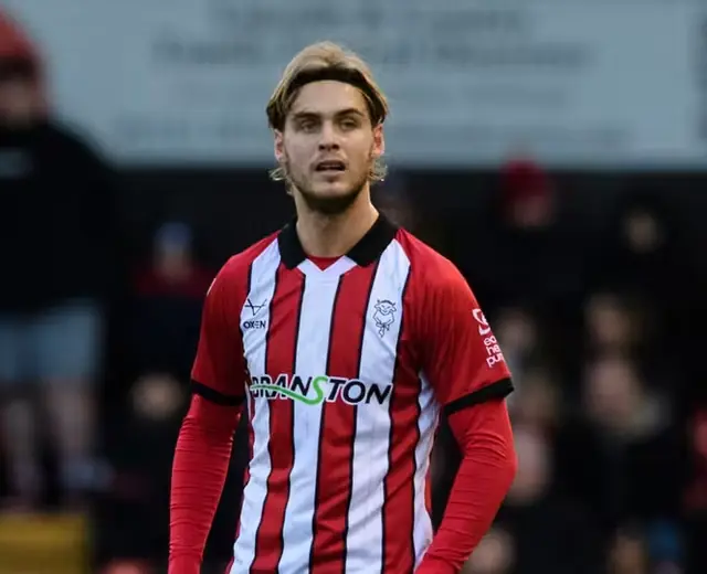 Ryley Towler, Lincoln City centre-back, in action